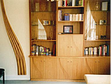 A fitted dresser and wall sculpture